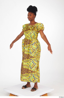 Dina Moses A poses dressed standing whole body yellow long…